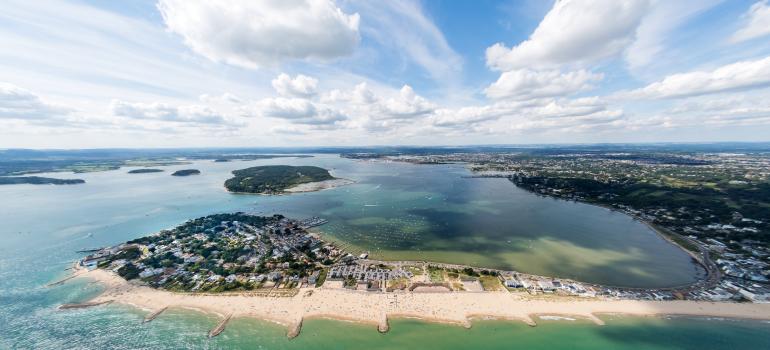 Aerial view of Poole Harbour and Brownsea Island and Dorset coastline.